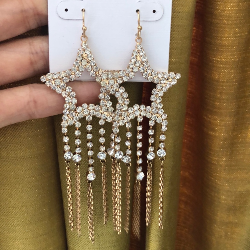 sparkle star dangling earrings by Neiman Marcus
